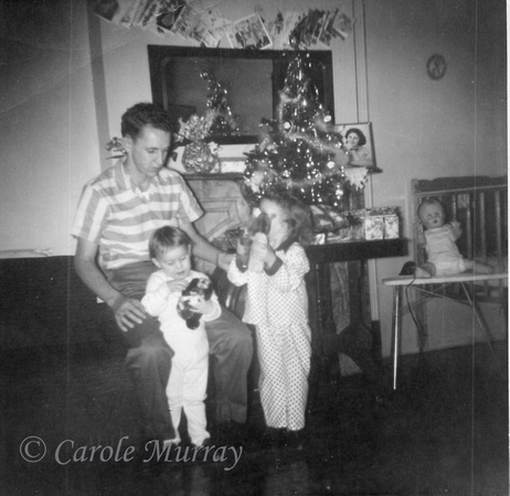 Debby and I with our Dad on Christmas morning, 1959.
