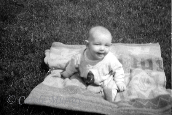 Debby was born in October 1956, so I imagine this photo was taken during the summer of 1957 -- which wasn't that long ago, now was it?  :-)
