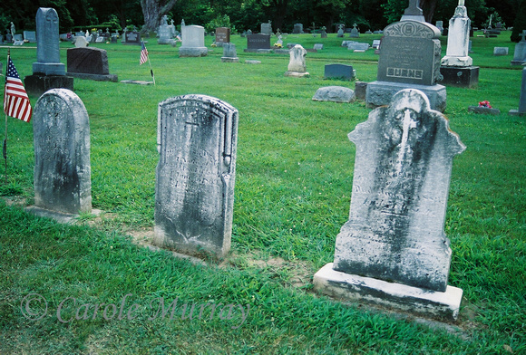 This is a picture of the three graves of Patrick McCARTNEY (center), with his daughter Margaret McCARTNEY on the left and his wife Ann (KEARNEY) McCARTNEY on the right.  These graves can be found in S