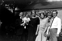 This may be Joseph Karres (1885 - 1930) holding daughter Trudy (1923 - 2007) and standing next to wife Charlotte (Lotte) Schuster.  The other couple may be Elisabeth Schuster Loew (1900 - 1981)and her