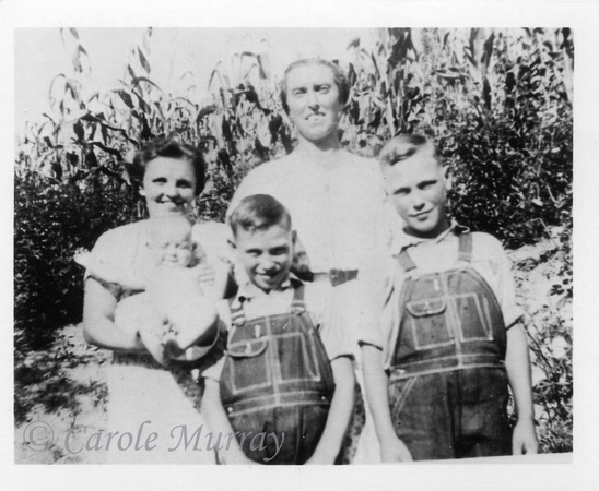 1942?  Beulah Maddron holding Wanda Geneva (?), beside Adelaide Davis Maddron and her sons Carl and Walter