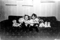 Christmas night 1946:  Diane and Lynne with all of their dolls