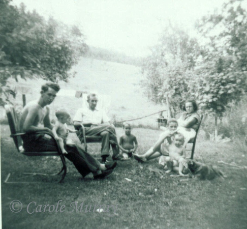 Another shot from the summer of 1958:Left to right:  Son Billy holding granddaughter Carole, Brad, grandson Donny, Blanche, with daughter Eugenia and granddaughter Debby sitting beside her.