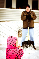 Daideo was keeping a close eye on Maeve Margaret as she made her snowman.  (January 15, 2012)© Carolyn S. Murray 2012