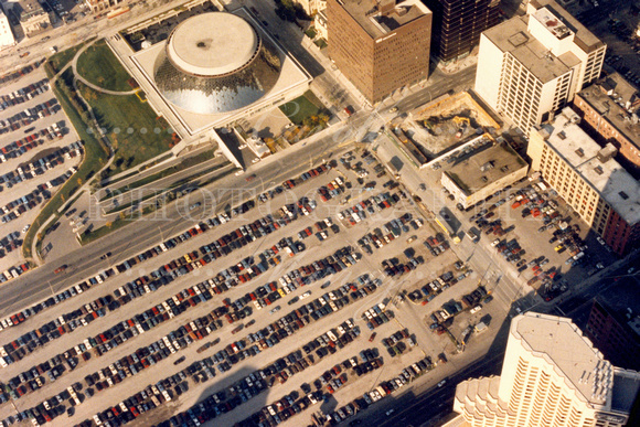 View looking down the observation deck of the CN Tower -- where you can see the Roy Thomson Hall .... and all those cars!  (October 1986)