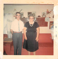 1966:  Papaw and Mamaw standing by the back wall of the living room, before the addition was built on the back.