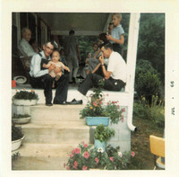1966:  the front porch of the house, full of family as usual