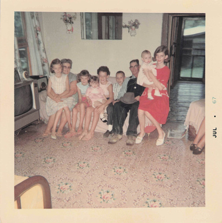 1967:  Mamaw and Papaw with some of the grandkids in the living room.  You can see the doorway to the bedroom on that side of the house.