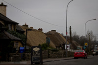 Adare is known for their thatched cottages.  We've been there twice already, so we didn't stop this time -- just snapped a couple of quick shots from the moving automobile.