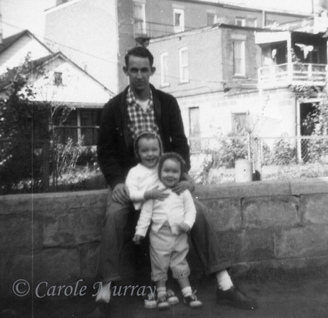Billy with daughters Debby and Carole outside their westside Cleveland home.  (October 1959)