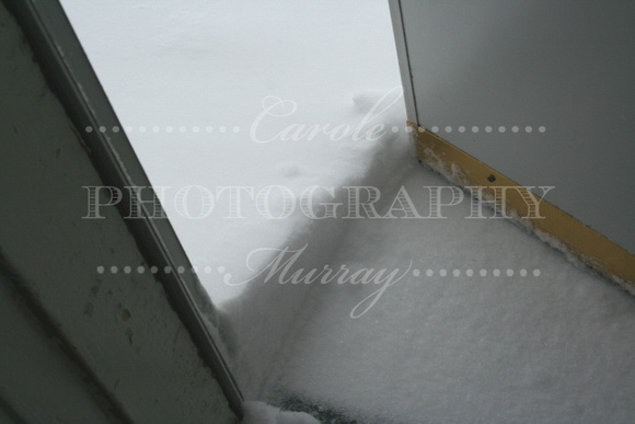 It was hard to even get out of the house, because the snow was piled up against the door!  (February 14, 2007)© Carolyn S. Murray 2007
