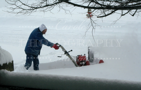 Another neighbor out snowblowing.  The snow was almost higher than the snowblower!  (February 14, 2007)© Carolyn S. Murray 2007
