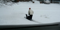 Our neighbors came over to borrow our snowblower -- and here's Chris making a path back to their house.  (February 14, 2007)© Carolyn S. Murray 2007