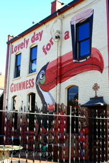 You know the Murrays are going to stop and take a picture of this!!!  It's a Guinness mural painted on the back of the Tree House, a bar in Tremont, which we've visited (of course!).© Carolyn S. Murra