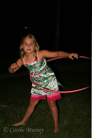 And then it was Ashley's turn to give the hula hoop a turn!  (June 24, 2008)© Carolyn S. Murray 2008